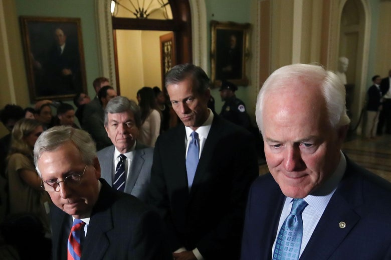 WASHINGTON, DC - DECEMBER 05: (L-R) Senate Majority Leader Mitch McConnell (R-KY), Sen. Roy Blunt (R-MO), Sen. John Thune (R-SD), and Sen. John Cornyn (R-TX) listen to reporters questions about the tax reform bill the Senate passed last week, at US Capitol on december 5, 2017 in Washington, DC. (Photo by Mark Wilson/Getty Images)